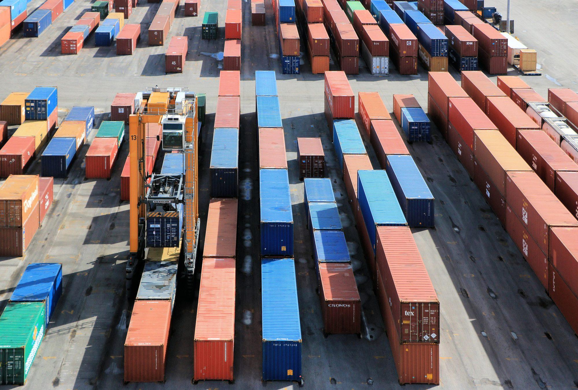 Stacked shipping containers in a port container park