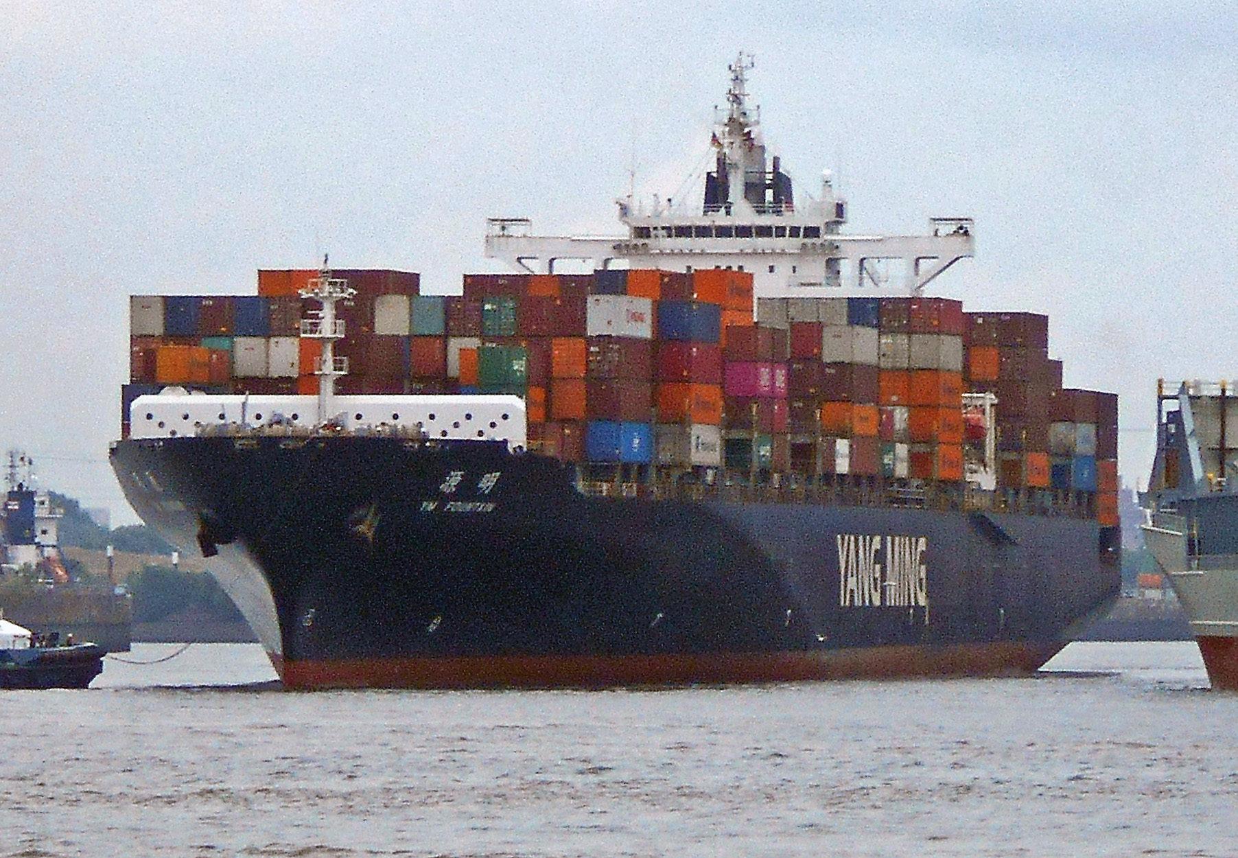 A fully loaded container vessel under way